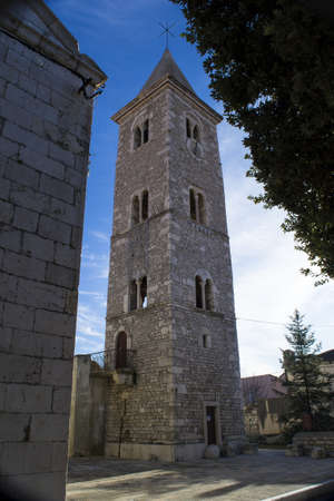 A vertical shot of the Tower Bell Church of Saint Anselmo in Nin Croatia