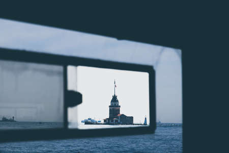 The Maiden's tower in Istanbul, Turkey. Photo taken from inside a cruise boat. This is a popular...