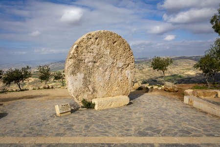 MOUNT NEBO, JORDAN - Mar 05, 2020: Mount Nebo, Jordan, March 2020: Abu Badd rolling wheel at Mount Nebo, Rolling stone used as the fortified door of a Byzantine monasteryのeditorial素材