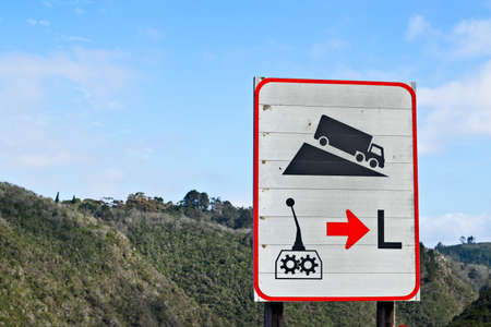 All trucks to use a low gear traffic signpost.の写真素材