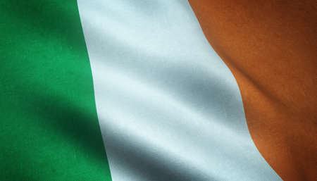 A closeup shot of the waving flag of Ireland with interesting textures