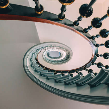 A high angle view of a modern spiral staircase under the lights