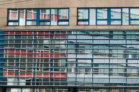 Buildings in Bratislava reflected from windows, urban city environment reflections