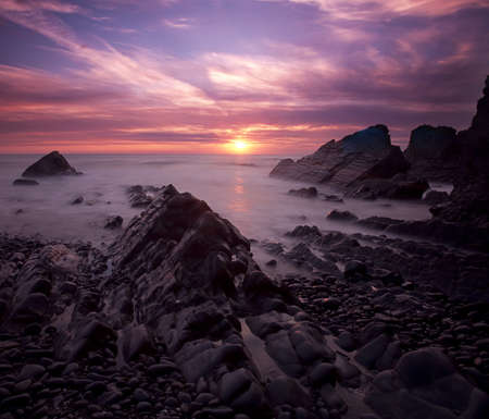 The breathtaking sunset at Duckpool Bay near Bude, North Cornwall, UK