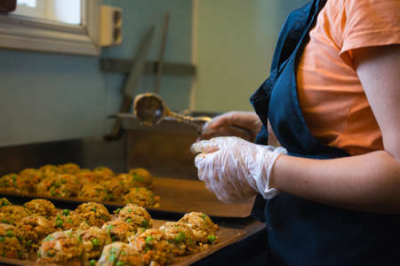 A cook preparing vegan patties for a local event in Kongsberg, Norwayの写真素材