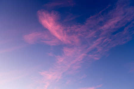 A colorful and amazing sky with bright pink clouds