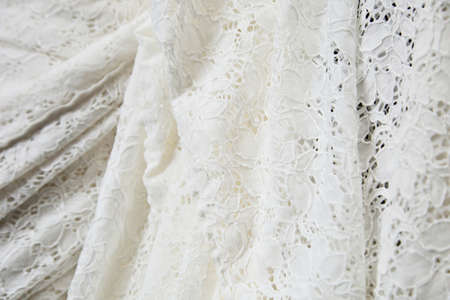 A closeup shot of a white curtain perfect for using as a background