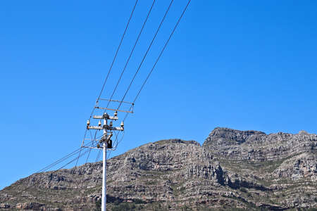 A low angle shot of a rock formation under the clear sky