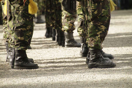A closeup shot of soldiers wearing uniforms standing in lines