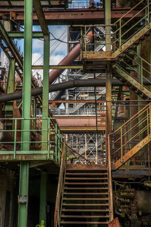 A vertical shot of a rusted staircase in the factory buildingsの写真素材