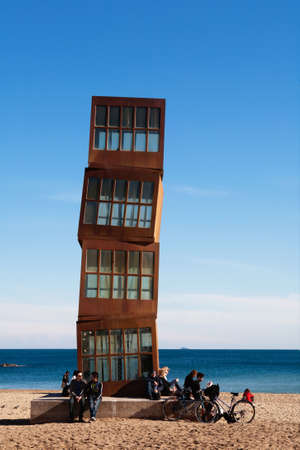 BARCELONA, SPAIN - Feb 07, 2009: People sitting around the sculpture by the artist Rebecca Horn...