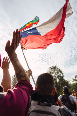SANTIAGO, CHILE - Nov 28, 2019: The protests show their dissatisfaction with the Chilean government due to the social crisis that plagues President PiÃ±era and Chileのeditorial素材