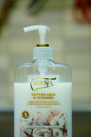 POZNAN, POLAND - Jan 11, 2020: Luksja hand soap with cotton milk and vitamins in a plastic bottle.のeditorial素材