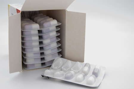 GLOUCESTER, UNITED KINGDOM - Jan 06, 2020: Medication in the form of capsules/pills/tablets against a white backgroundのeditorial素材