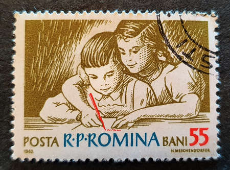 SOVATA, ROMANIA - Jul 02, 2020: An old stamp from Romania, 1962 edition with the image of pioneering students from the communist periodのeditorial素材