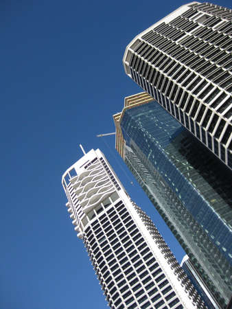 A low angle shot of Brisbane buildings with a clear sky in the background