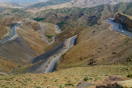 A closeup shot of roads going up and down on mountainsの写真素材