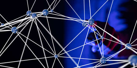 A person working with a virtual projection of the digital network - data protection conceptの写真素材