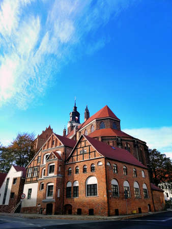 A bottom view shot of St. Mary's Church during daytime in Stargard, Poland