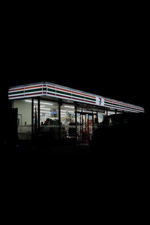 MATSUYAMA, JAPAN - Jul 24, 2019: A vertical selective dark shot of a market during nighttime
