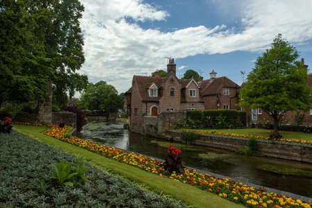 The road surrounded by buildings and gardens after the rain in Canterbury in the UK