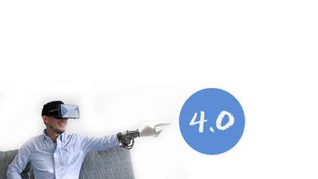 A male wearing virtual reality headset pointing to the Industry 4.0 sign with a white background