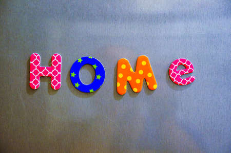 The word no made of colorful magnetic letters on a brown backgroundの写真素材