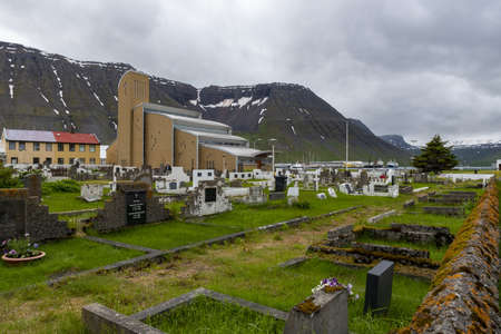 A high angle shot of a small cemetery under the cloudy sky in Icelandの写真素材