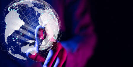 A businessman working with a virtual projection of global networkの写真素材