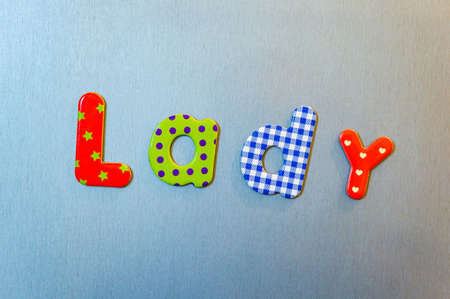 A high angle shot of cute letters spelling the word Lady