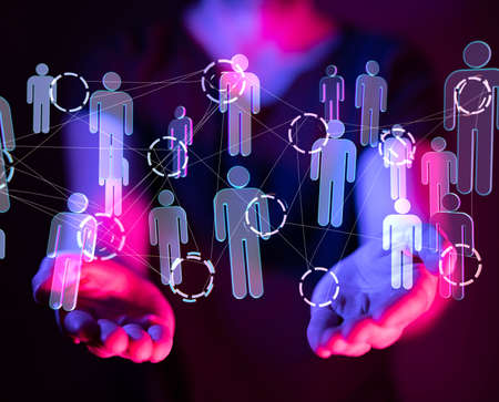 A businessman working with a virtual projection of social media communication Internet networkの写真素材