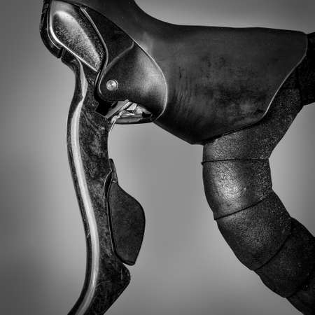 A closeup shot of a metal object in front of a dark background