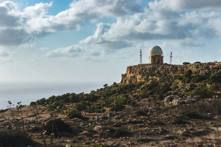 A mesmerizing scenery of a rock formation at the ocean shore in Malta