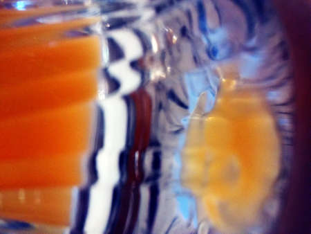 A closeup shot of a surface painted with multiple colors and patterns