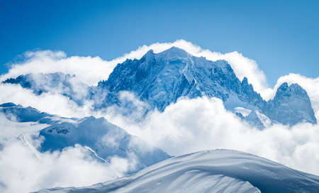 High snowy mountain landscape with blue skyの写真素材