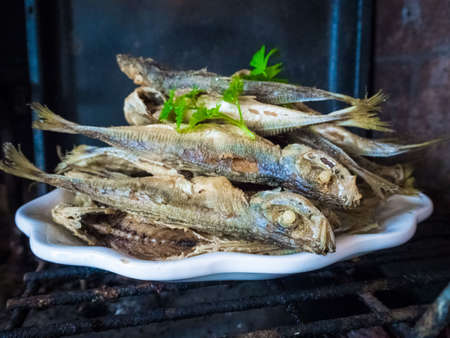 Delicious Fried Atlantic horse mackerel in a white plate - Portuguese traditional foodの写真素材