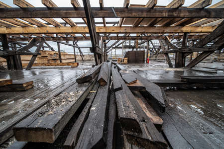 Several pieces of wood and metal put in a seemingly incomplete construction