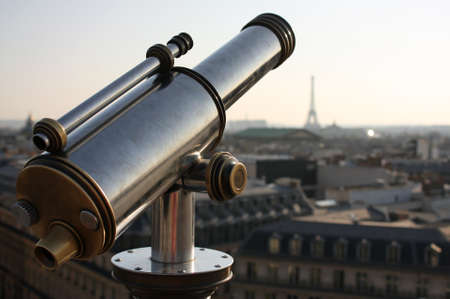 A closeup shot of a binocular looking at the Eiffel Tower in Parisの写真素材