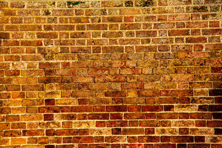 Close-up of an old red brick wall in dusk light