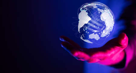 A businessman working with a virtual projection of global networkの写真素材