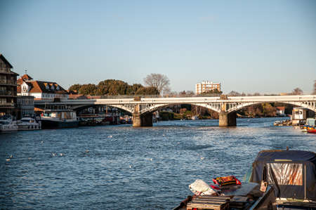 Bridge over a wide riverの写真素材