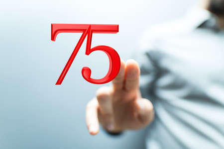 A person presenting a virtual projection of the seventy fifth-anniversary numberの写真素材