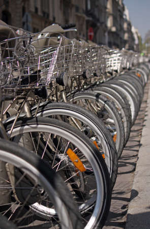 A closeup shot of several bicycles put next to each otherの写真素材