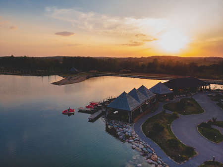 A beautiful sunset and its reflection in the waterの写真素材