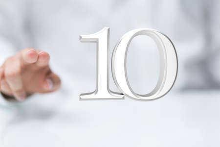A person presenting a visual projection of digital number ten at a meetingの写真素材