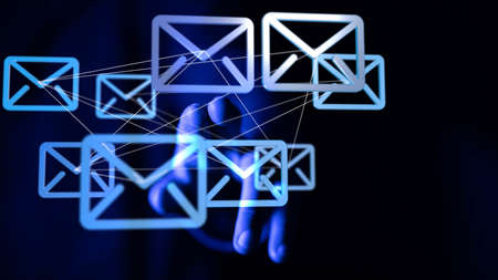 A person working with a virtual projection of mail communication iconsの写真素材
