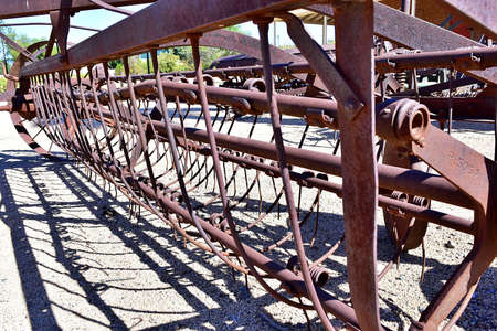 GLENDALE, UNITED STATES - Oct 18, 2019: Old rusted steel farm equipment.  tiller