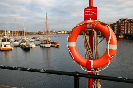 A selective focus shot of a lifebuoy ring in a sailboat with a blurred background