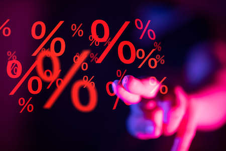 A businessman touching virtual percentage iconの写真素材