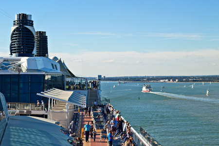 SOUTHAMPTON, UNITED KINGDOM - Jul 03, 2019: A cruise ship with passengers departing the Port of Southampton.の写真素材